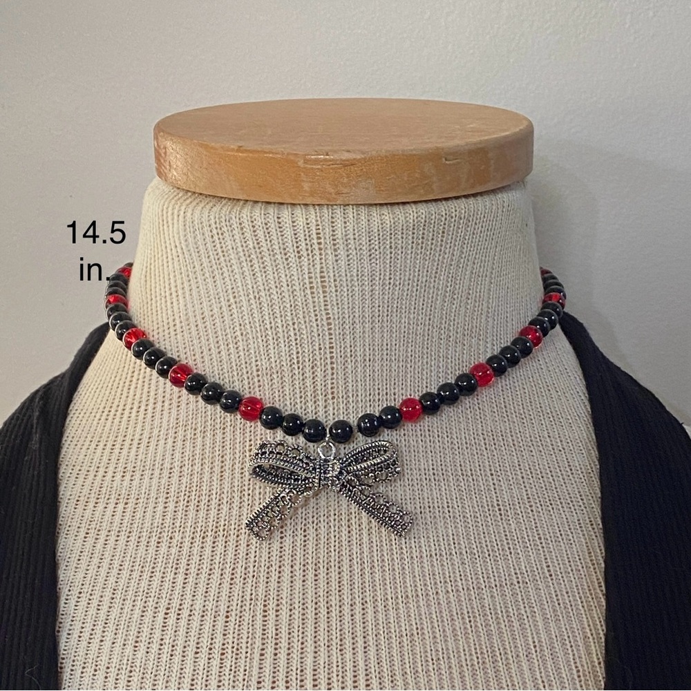 Elegant Black and Red Beaded Necklace with Bow Pendant